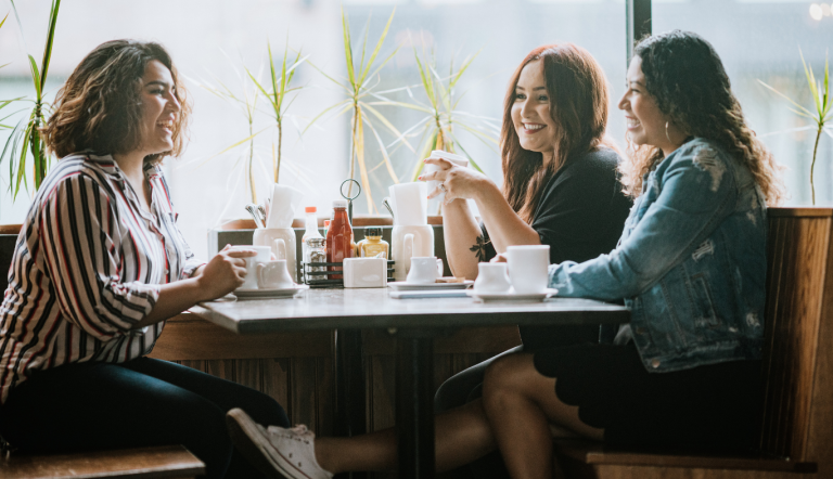 Group of women friends eating together on the weekend.