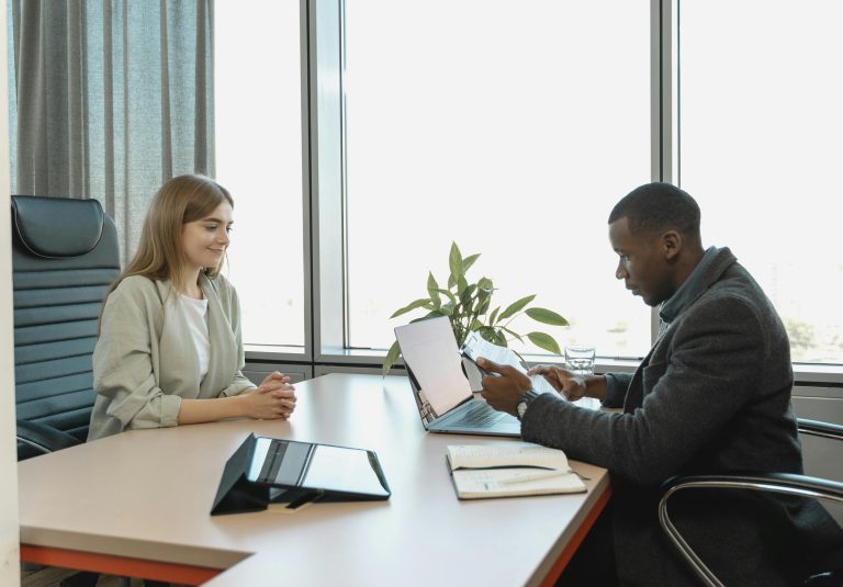 Man Interviewing A Woman
